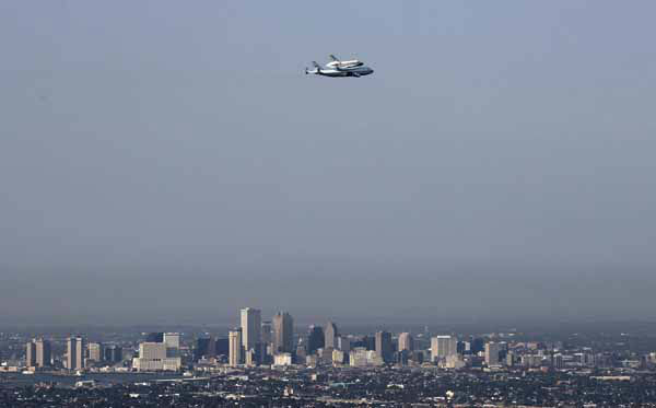 The space shuttle Endeavour is shown taxiing...