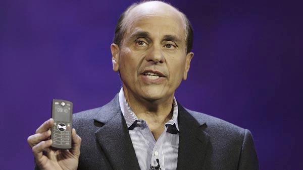 Ed Zander, chairman and CEO, Motorola Inc. shows the Motofone, a new phone with a high-contrast reflective display using a new technology invented at MIT and commercialized by E Ink, during his keynote speech at the 2007 International Consumer Electronics Show (CES) in Las Vegas in this Monday, Jan. 8, 2007 file photo. As a result of Motorola acknowledging Wednesday, July 11, 2007, that its struggling cell phone business will be unprofitable at least until 2008, Zander is coming under fire with a grassroots campaign to oust him, and four other board members, led by a group of small investors and includes an online petition, blog and five-minute video manifesto. (AP Photo/Damian Dovarganes, File)