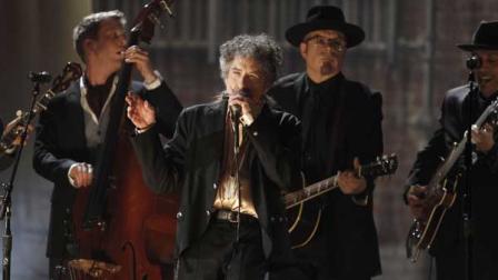 Bob Dylan, center, performs at the 53rd annual Grammy Awards on Sunday, Feb. 13, 2011, in Los Angeles.