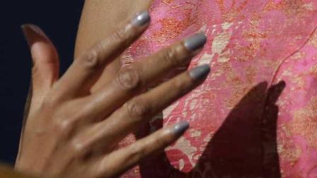 Michelle Obamas manicure is shown next to her Tracy Reese dress at the DNC.