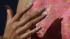 Michelle Obamas manicure is shown next to her...