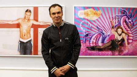 US photographer David LaChapelle poses in front of two of his art pieces after a press conference in Berlin, Friday, Dec. 1, 2006. The photo exhibit Newton Nachtwey LaChapelle Men, War and Peace at the Museum of Photography in Berlin is open to the public from Dec. 3, 2006 to May 20, 2007.