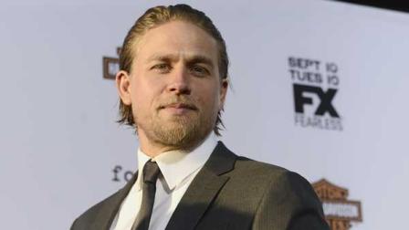 Actor Charlie Hunnam arrives on the red carpet at the season six premiere screening of the television series Sons of Anarchy at the Dolby Theatre on Saturday, Sept. 7, 2013 in Los Angeles.