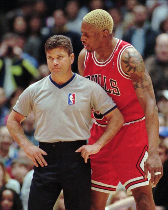 Chicago Bulls' Dennis Rodman talks to referee...