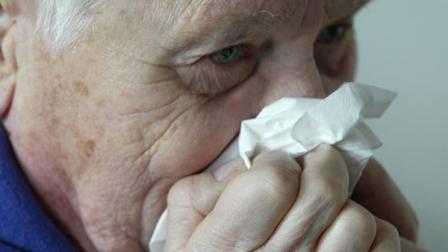 (FILE) An elderly patient blows his nose on Friday, January 14, 2005.