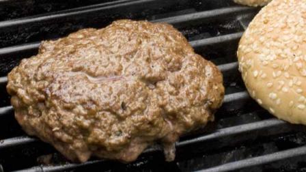 FILE- Burger on grill