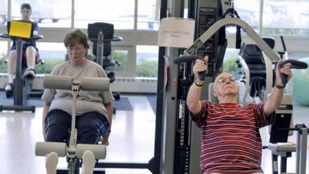 Rich Watton, right, Carol Roinson, center, and Janice Howell, back left, exercise in the gym at the Enfield Senior Center in Enfield, Conn., Wednesday, Aug. 13, 2008.