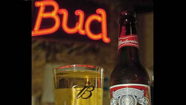 In this Oct. 25, 2005 file photo, bottled and draught Budweiser beers are shown at a bar. (AP Photo/Tom Gannam, file)