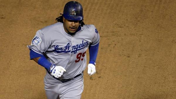 Los Angeles Dodgers Manny Ramirez rounds the bases after hitting a home run during seventh-inning baseball action in Game 1 of the National League division series against the Chicago Cubs, Wednesday, Oct. 1, 2008, in Chicago. (AP Photo/Charles Rex Arbogast)