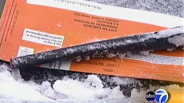 File photo of a parking ticket on the windshield of a car in Chicago.