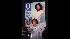 Oprah Winfrey stands in front of the cover of...