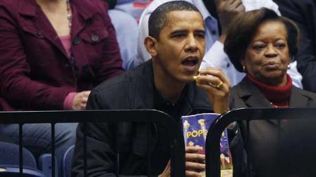 FILE - In this Nov. 28, 2009 file photo, President Barack Obama and his mother-in-law Marian Robinson watch a college basketball game between George Washington University and Oregon State in Washington. Michelle Obamas brother Craig Robinson is head coach of Oregon State. President Barack Obamas mother-in-law lived in Chicago all her life, so it was only natural that her move to the White House came with some kicking and screaming. Just try it for three months, her son-in-law says the family suggested. A year later, what had been described as a temporary relocation is looking permanent.