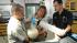 Michael Adkesson, DVM, DIPL.ACZM, associate veterinarian for the Chicago Zoological Society (right) oversees an American white pelican being anesthetized by Michael O'Neill and Denise Young, senior keepers/Veterinary Services, as they prepare the bird for a physical examination at Brookfield Zoo's Animal Hospital The bird, along with four other pelicans, was rescued from the Gulf Coast oil spill. They arrived at Brookfield Zoo on July 18, and following a 30-day quarantine period, they will be placed on permanent exhibit at the zoo's Formal Pool.