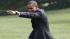 President Barack Obama points towards visitors...