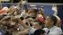 President Barack Obama shakes hands with workers...