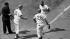 Chicago Cubs Ernie Banks, center, trots up to...