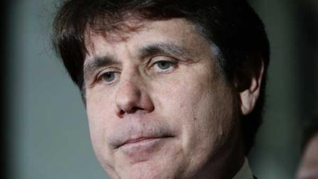 Former Illinois Gov. Rod Blagojevich pauses as he talks with reporters at the Federal Court building after the judge handed the case to the jury in his corruption trial Thursday, June 9, 2011 in Chicago.