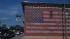 An American flag is painted on the side of a...