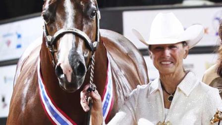 This Nov. 2011 photo provided on April 18, 2012, by The American Quarter Horse Journal, shows Rita Crundwell, of Dixon, Ill., posing with Pizzazzy Lady at the 2011 American Quarter Horse Association World Championship Show in Oklahoma City. On Tuesday, April 17, 2012, FBI agents arrested Crundwell, the Dixon comptroller, on charges that she stole more than $3.2 million in public funds from the city of Dixon in just a matter of months. She also was accused of misappropriating more than $30 million since 2006 to finance a lavish lifestyle, including operating a horse farm.