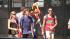 Lollapalooza fans and visitors walk up to the...