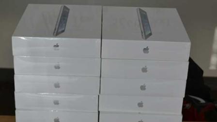 Police say they discovered 85 iPads worth more than $50,000 and other items, as well as a handgun and $10,000 in cash.