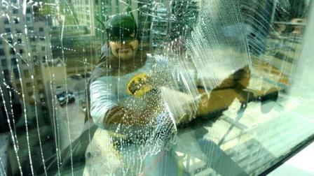 A window washer dressed as Batman surprises patients at Lurie Childrens Hospital in downtown Chicago.
