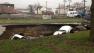 Three cars in sinkhole at 96th and Houston.