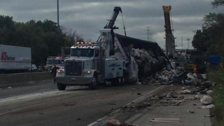 Overturned garbage truck at I-55 near Route 30 in Joliet.