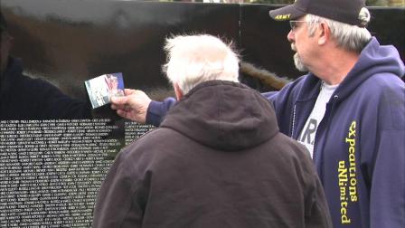 A replica of the Vietnam Veterans Memorial called the Moving Wall is on display Thursday night in Aurora.
