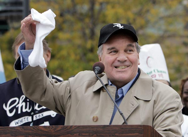 Chicago Mayor Richard Daley holds up a pair of...