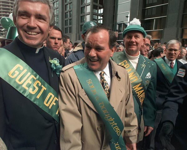 Chicago Mayor Richard Daley, center, leads the...