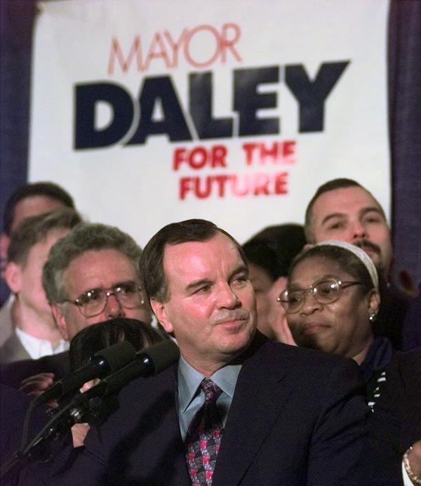 Chicago Mayor Richard M. Daley, center, smiles...