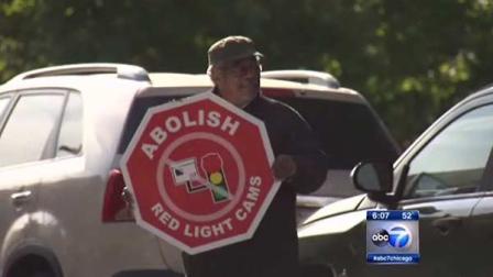 A group of Chicago residents hold a demonstration to protest red-light cameras in the city.