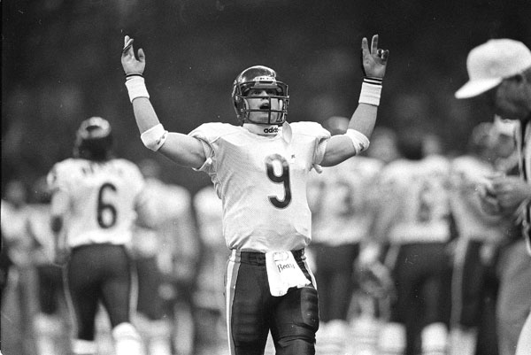 Chicago Bears quarterback Jim McMahon works the...