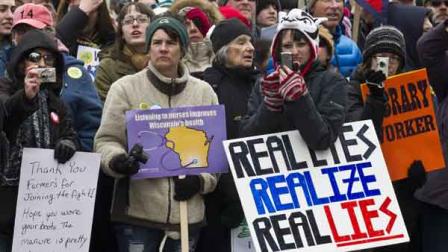 Protesters march outside the state Capitol in Madison, Wis., Saturday, March 12, 2011. Gov. Scott Walker has already signed a contentious collective bargaining bill into law, but demonstrators insist the fight is not over.