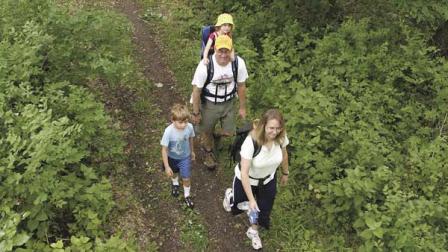 (FILE) Jeff and Lisa Messaer hike with their two children Matthew and Morgan along a section of the Ice Age Trail between Milton and Janesville, Wis., on June 7, 2008.