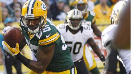 Green Bay Packers wide receiver Greg Jennings catches a touchdown pass in front of New Orleans Saints free safety Isa Abdul-Quddus, right, during the first half of an NFL football game Sunday, Sept. 30, 2012, in Green Bay, Wis.