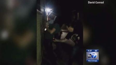 Cell phone video shows the Chicago Bears fan who used a stun gun on his wife, a Green Bay Packers fan.