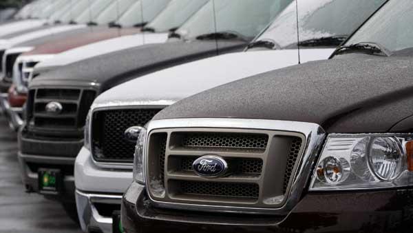FILE-- A row of unsold 2008 F-150 pickup trucks at a Ford dealership in the east Denver suburb of Aurora, Colo., on Sunday, Jan. 20, 2008. (AP Photo/David Zalubowski)