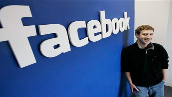 Zuckerberg smiles at his office in Palo Alto, Calif in this AP file photo.