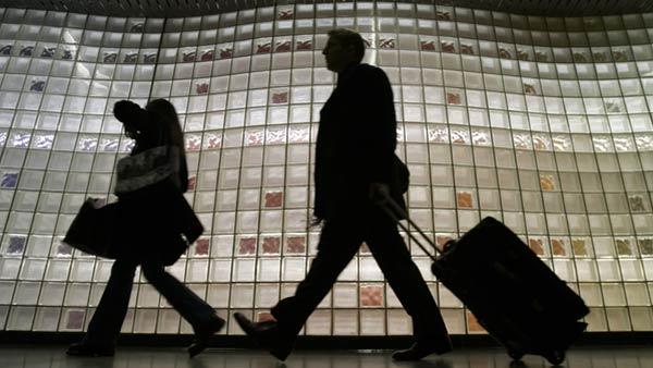 FILE-- A crowd of travelers make their way into OHare International Airport Wednesday, Nov. 23, 2005, in Chicago.