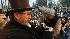 Punxsutawney Phil, right, is held by Ben Hughes...