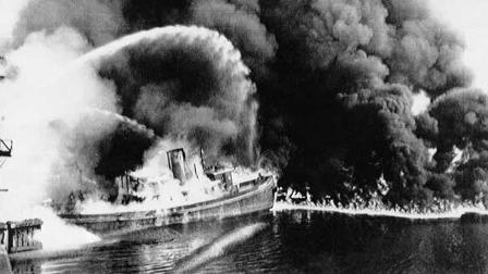In this June 25, 1952 file photo, a fire tug fights flames on the Cuyahoga River near downtown Cleveland, Ohio, where oil and other industrial wastes caught fire.