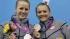US Silver medalists Abigail Johnston, left, and Kelci Bryant, right, pose during the medal ceremony for the 3 Meter Synchronized Springboard final at the Aquatics Centre in the Olympic Park during the 2012 Summer Olympics in London, Sunday, July 29, 2012. 