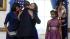 President Barack Obama hugs daughter Malia as...