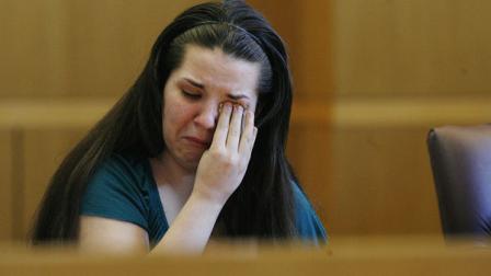 Jennifer Mee holds reacts as the jury selection begins her murder trial, Tuesday, Sept. 17, 2013, at the Pinellas County Justice Center in Clearwater, Fla. Mee, 22, who found fame in 2007 as a teen because of her uncontrollable hiccupping, is charged with first-degree murder in the 2010 death of Shannon Griffin.
