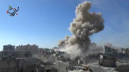 [FILE] This image made from citizen journalist video posted by the Shaam News network, which is consistent with AP reporting, shows shelling in the Barzeh area of Damascus, Syria Tuesday, Sept. 17, 2013.  