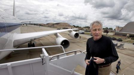 In this Sept. 28, 2013, file photo U.S. Secretary of Defense Chuck Hagel boards his plane at Andrews Air Force Base, Md., en route to South Korea. Saturday, Oct. 5, 2013, the Pentagon ordered most of its approximately 400,000 furloughed civilian employees back to work. The decision by Hagel is based on a Pentagon legal interpretation of a law called the Pay Our Military Act. That measure was passed by Congress and signed by President Barack Obama shortly before the partial government shutdown began Tuesday, Oct. 1. The Pentagon did not immediately say on Saturday exactly how many workers will return to work, but use the term most. (AP Photo/Jacquelyn Martin, File)