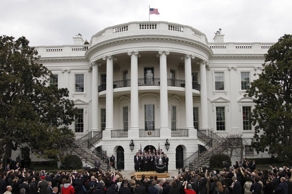President Barack Obama, center, poses for a...