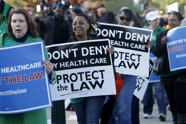 Supporters of the health care reform law signed...
